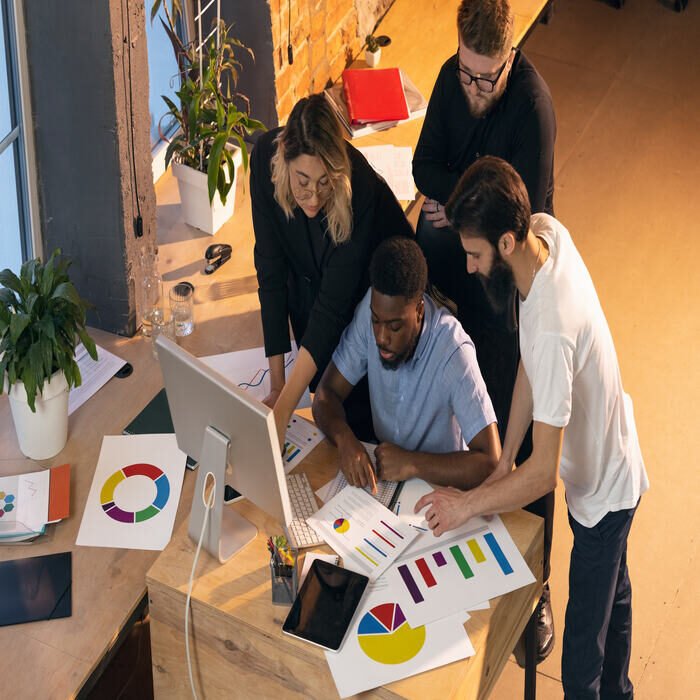 colleagues-working-together-in-modern-office-using-2023-11-27-05-13-56-utc (1)