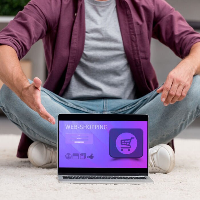 cropped-view-of-man-pointing-at-laptop-with-online-2023-11-27-04-49-59-utc (1)