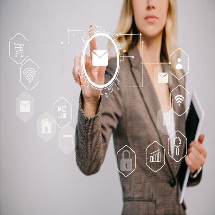 cropped-view-on-businesswoman-in-suit-holding-digi-2023-11-27-05-07-52-utc (1)