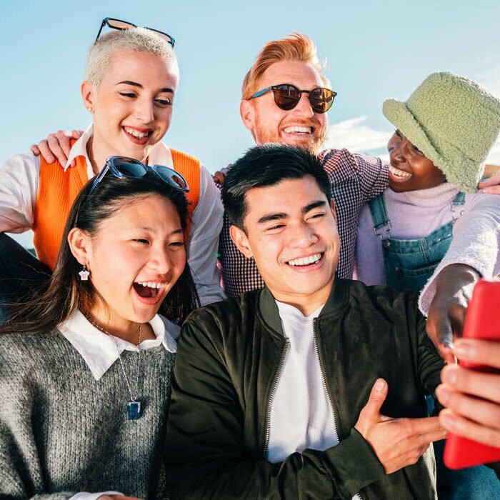 group-of-friends-watching-a-video-in-smartphone-sm-2023-11-27-05-30-21-utc (1)