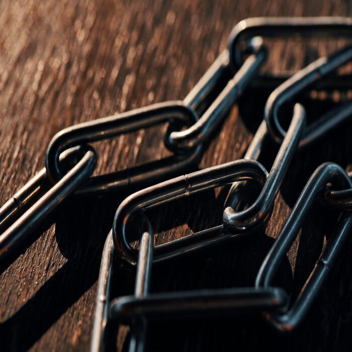 the-chain-on-an-old-wood-background-2023-11-27-05-15-58-utc (1)