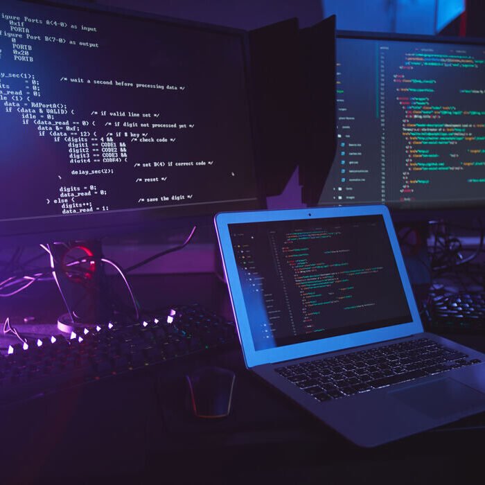 various-computer-equipment-with-programming-code-screens-table-dark-room-cyber-security-concept-copy-space (2) (1)